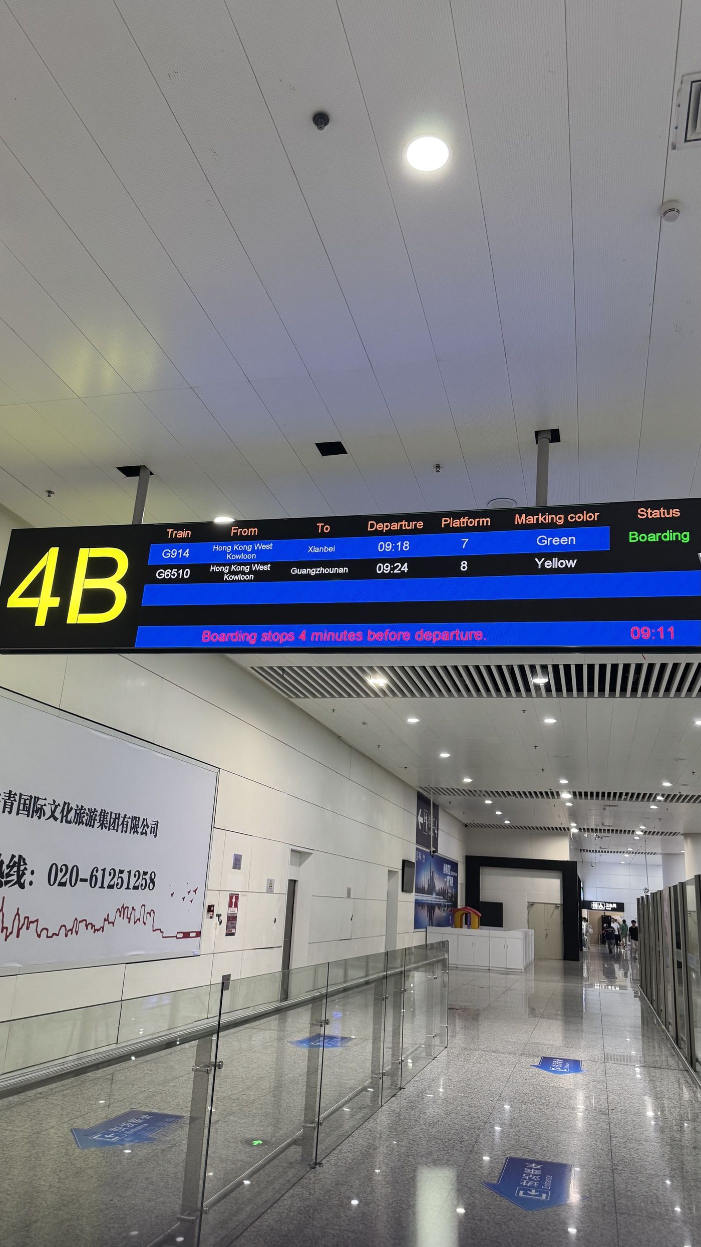 Gate board in context, overhead the queuing area, unmodified photograph